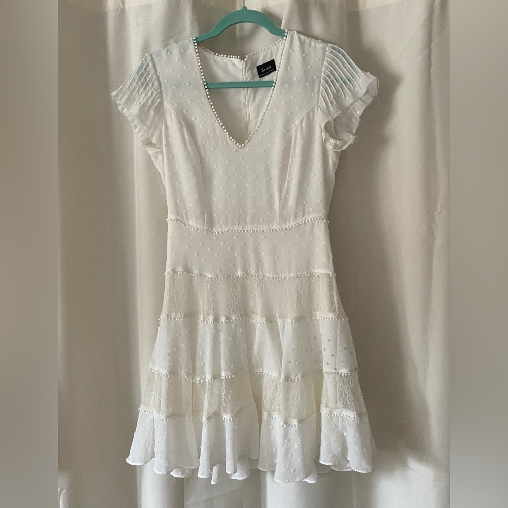 Beautiful white lace and chiffon dress. Gently worn a couple of times.